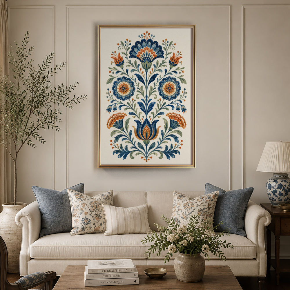 Folk art floral illustration with symmetrical blue and orange daisy and carnation, displayed in a warm light living room