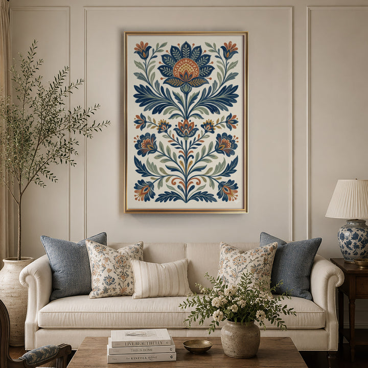 Folk art floral illustration with symmetrical blue and orange lotus and tulip motifs, displayed in a warm light living room